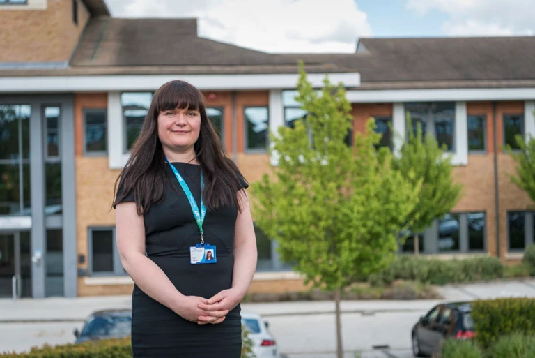 Environmental Sustainability Manager Claire O'Brien with our office in the background