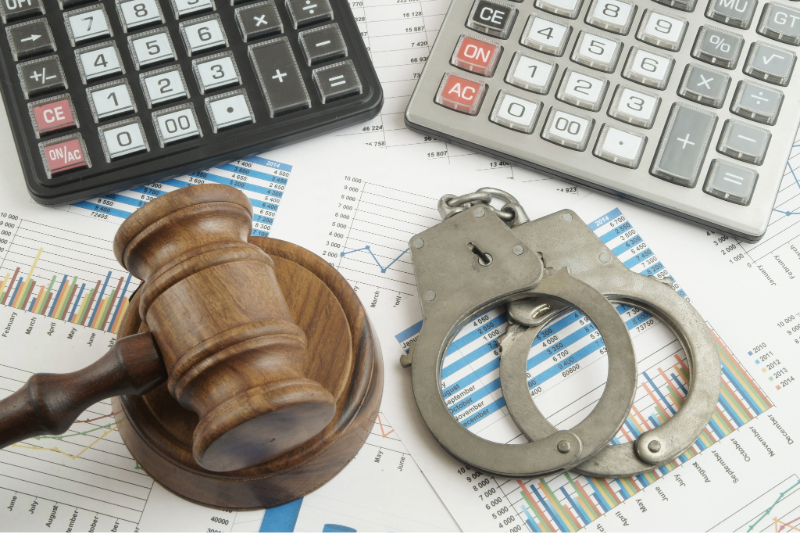 tenancy-fraud, a court hammer with financial reports and calculators