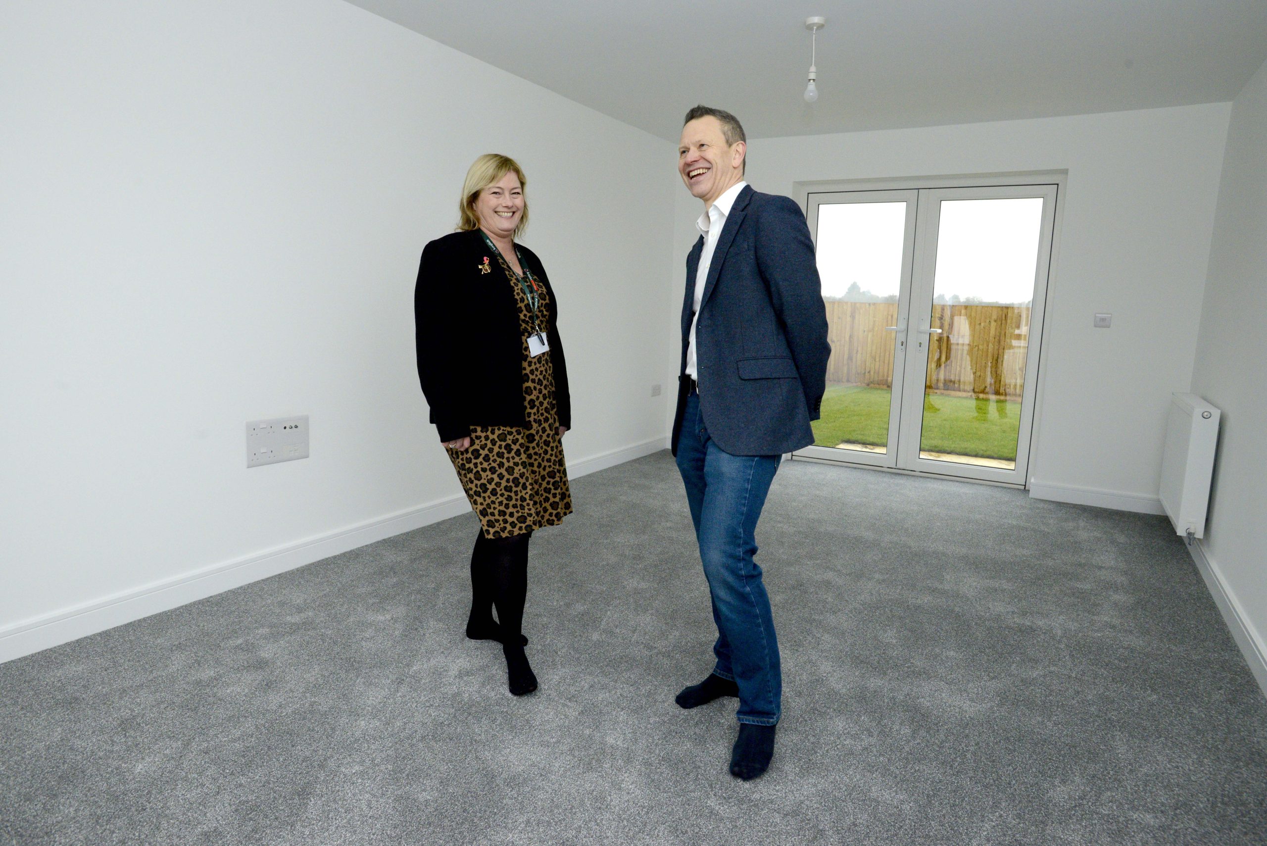 Representatives from Amplius and Allison Homes stood inside a new home